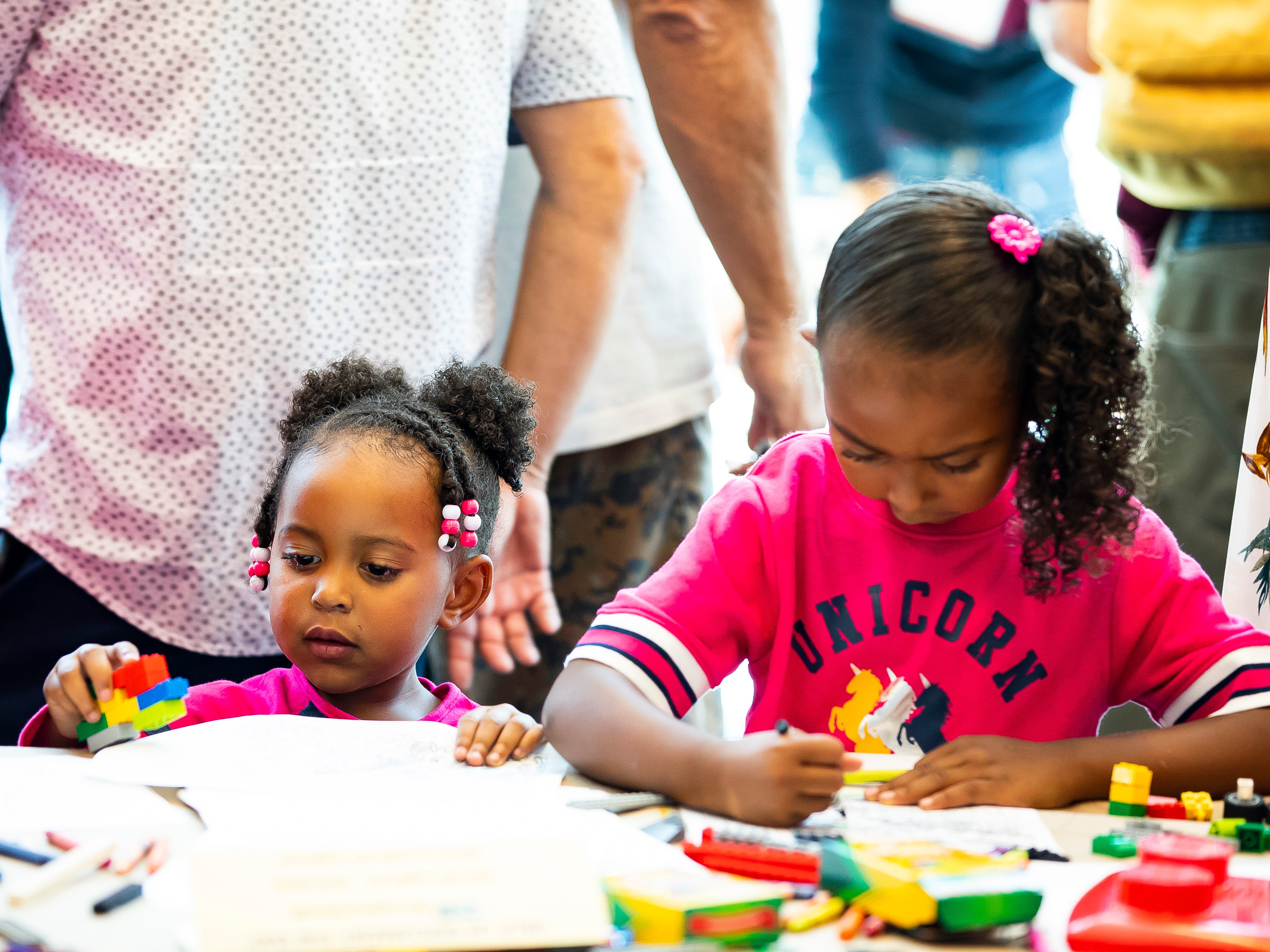Two young girls playing with toys Two young girls playing with toys