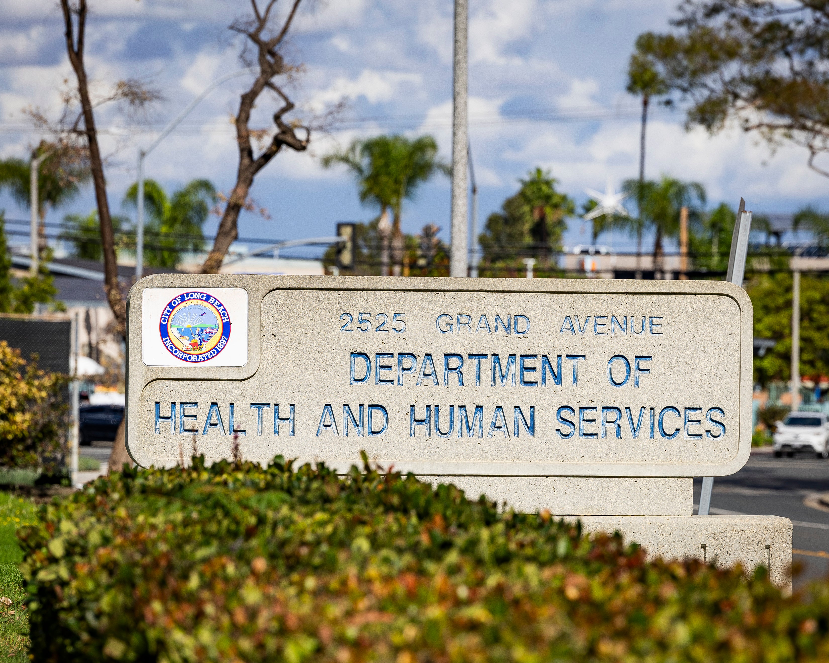 A closeup of a concrete sign for Health and Human Services building. A closeup of a concrete sign for Health and Human Services building.