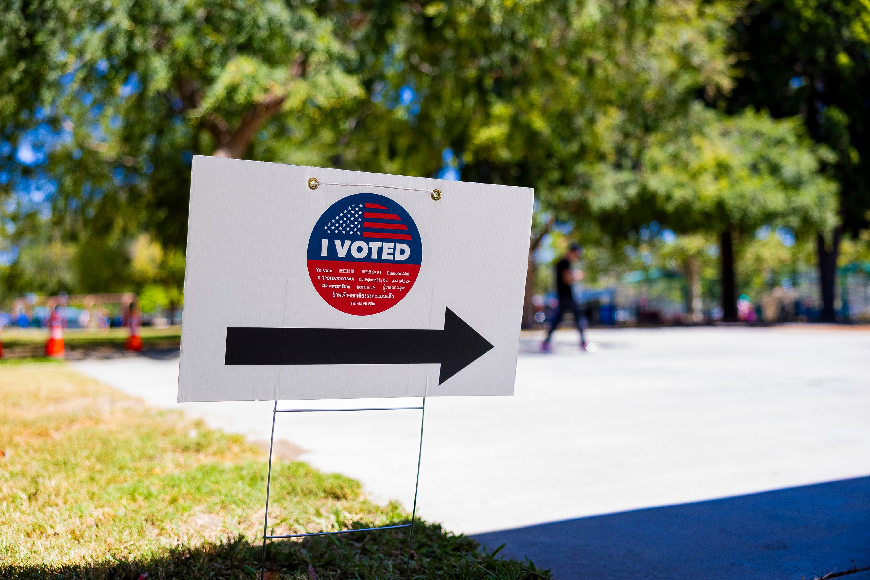 A sign pointing the voting center, that has the "I voted" logo. A sign pointing the voting center, that has the "I voted" logo.