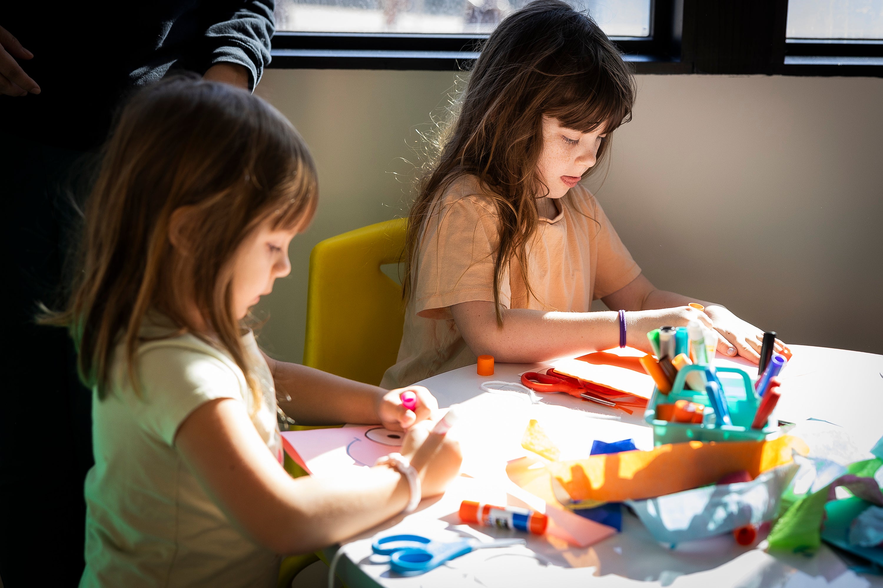 Two young girls doing crafts Two young girls doing crafts