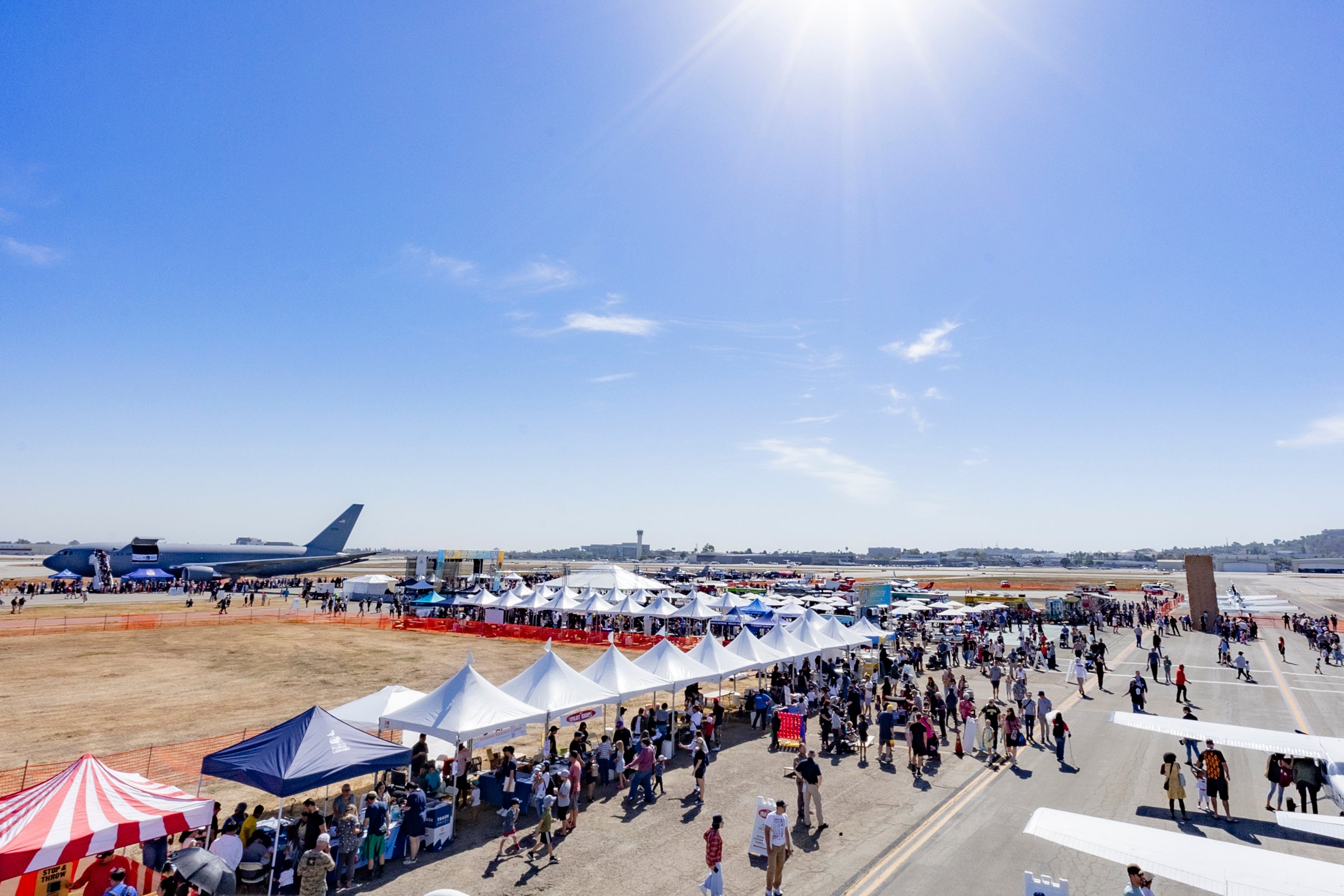 Field with airplane and tents  Field with airplane and tents