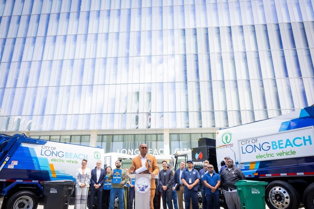 A group of people stand in front of a podium A group of people stand in front of a podium