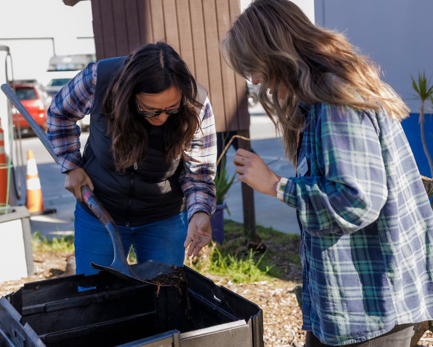 Compost and Recycling Ambassador (CRA) Program participants reviewing compost.