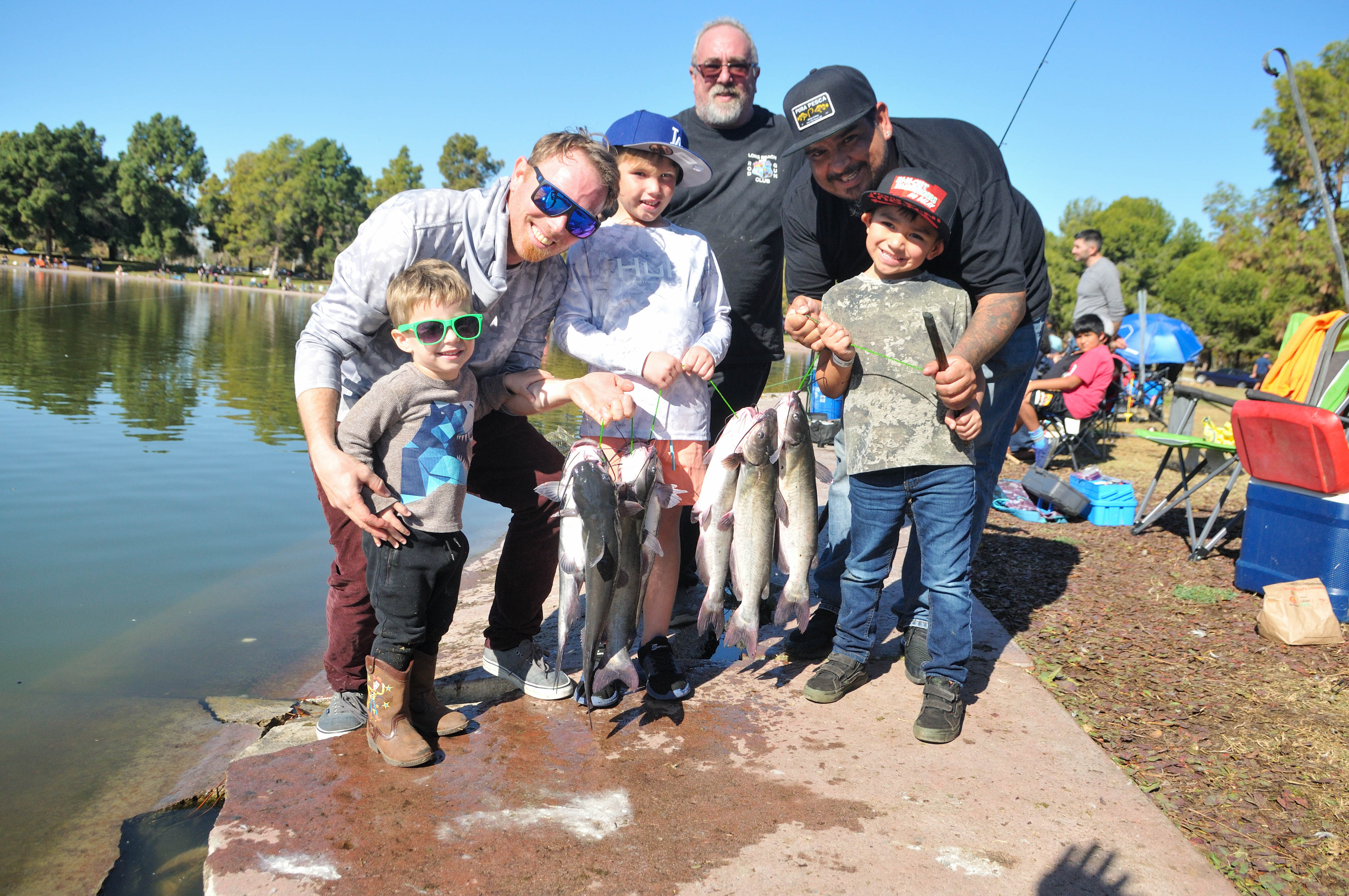 Family holding a fish Family holding a fish