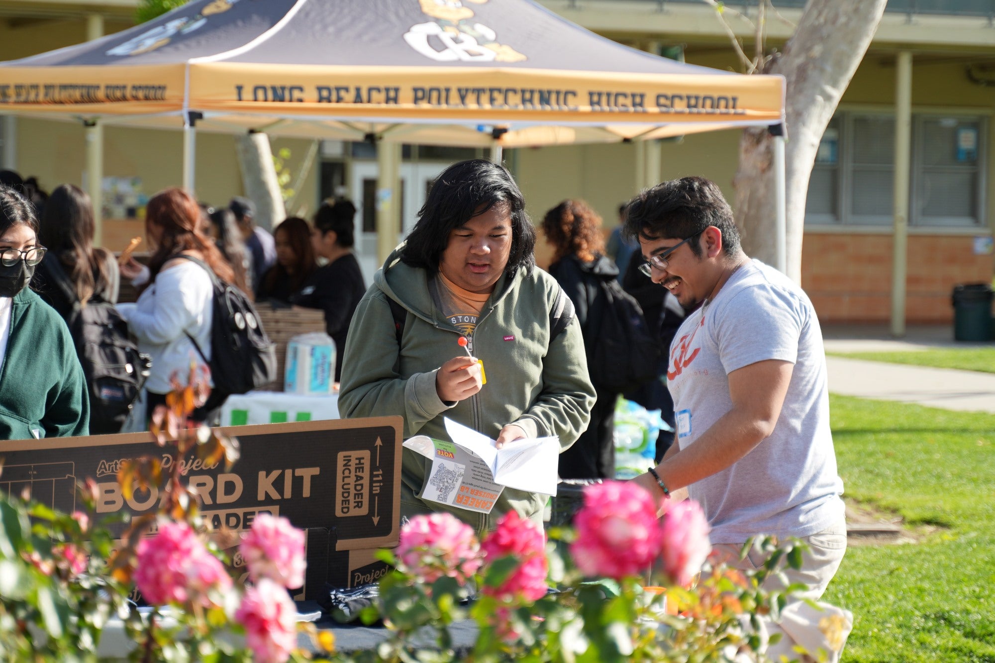 Two men standing by a table Two men standing by a table
