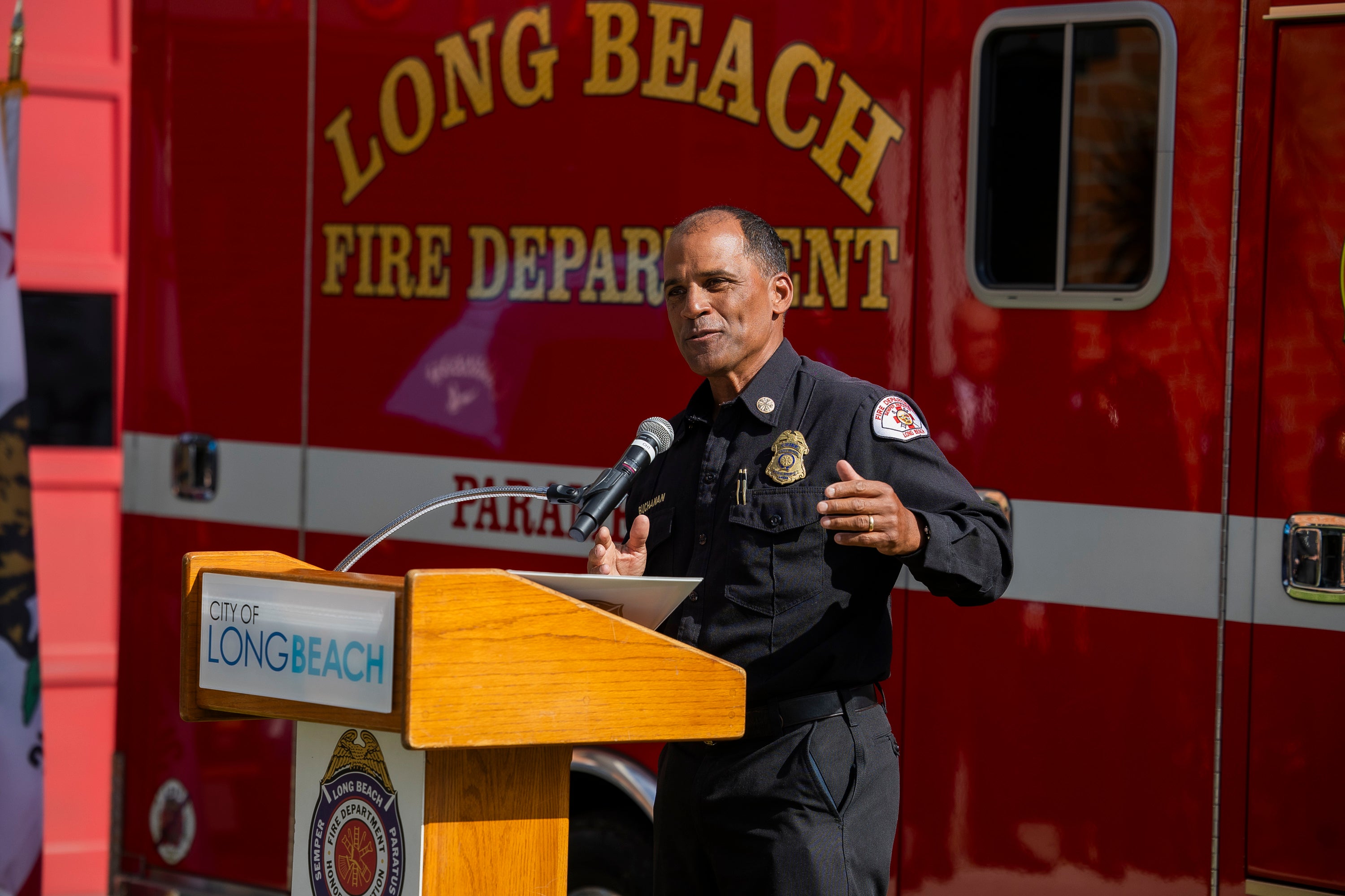Firefighter chief speaks at podium Firefighter chief speaks at podium