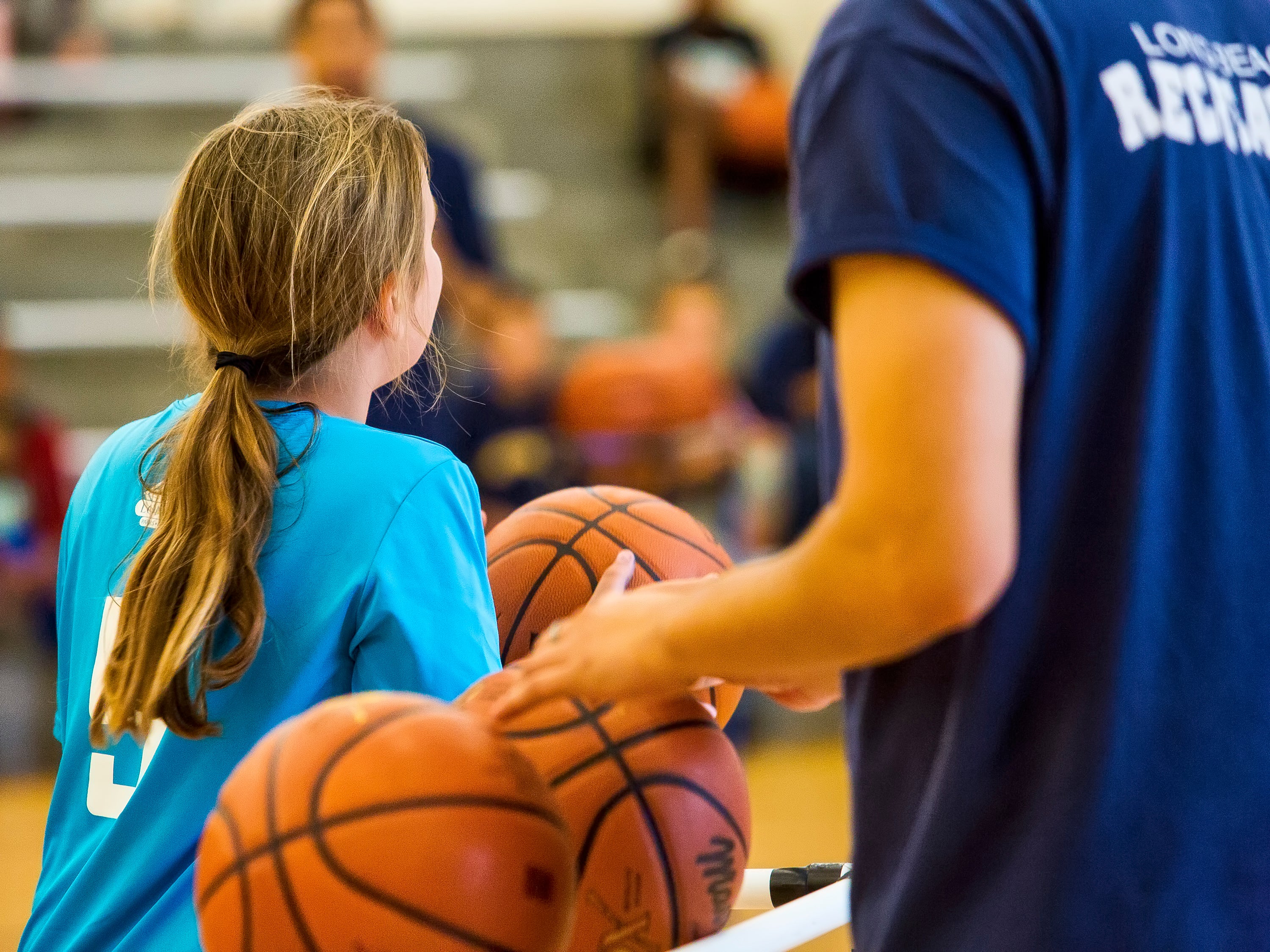 A girl playing basketball. A girl playing basketball.