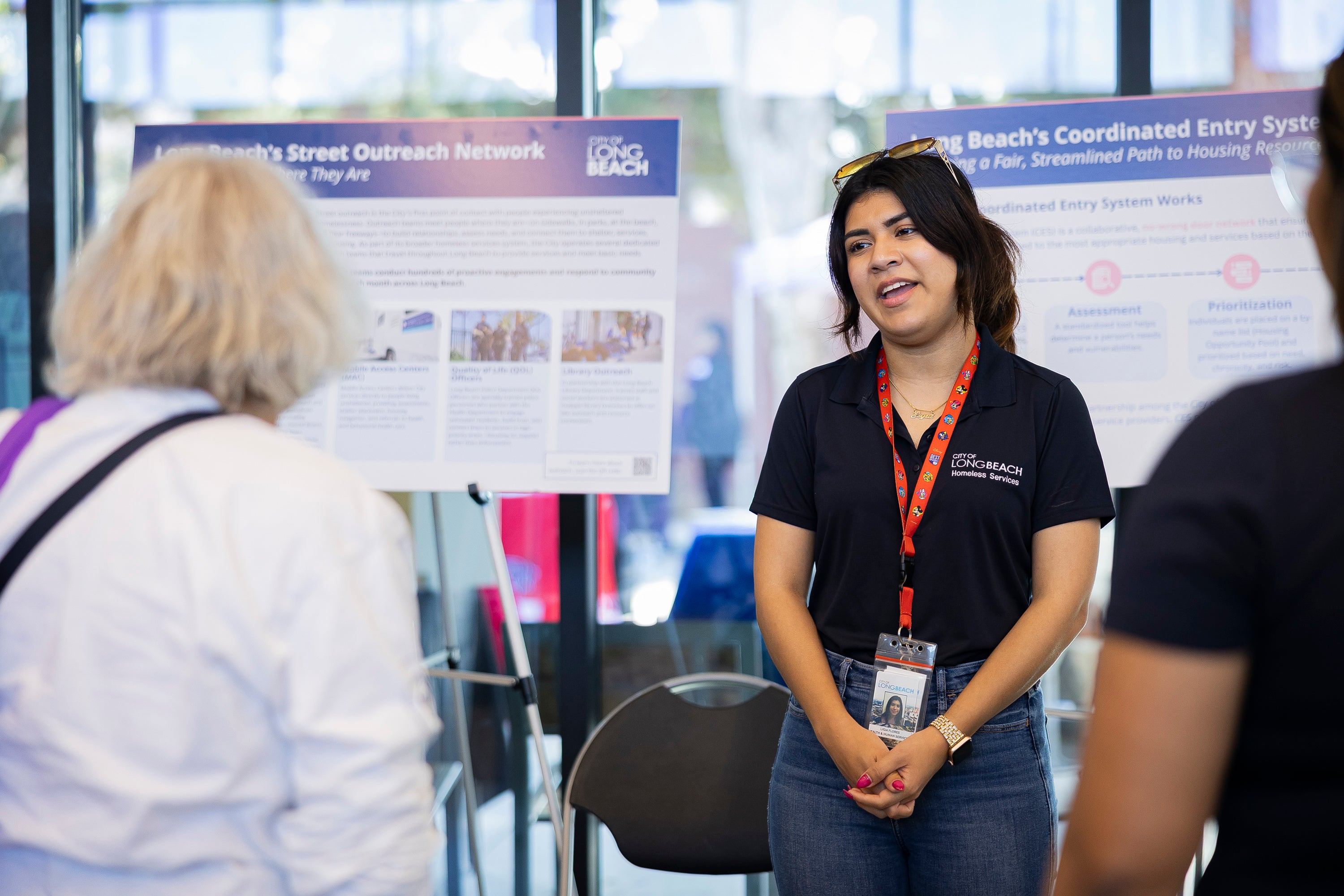 Woman presents to a group of people. Woman presents to a group of people.