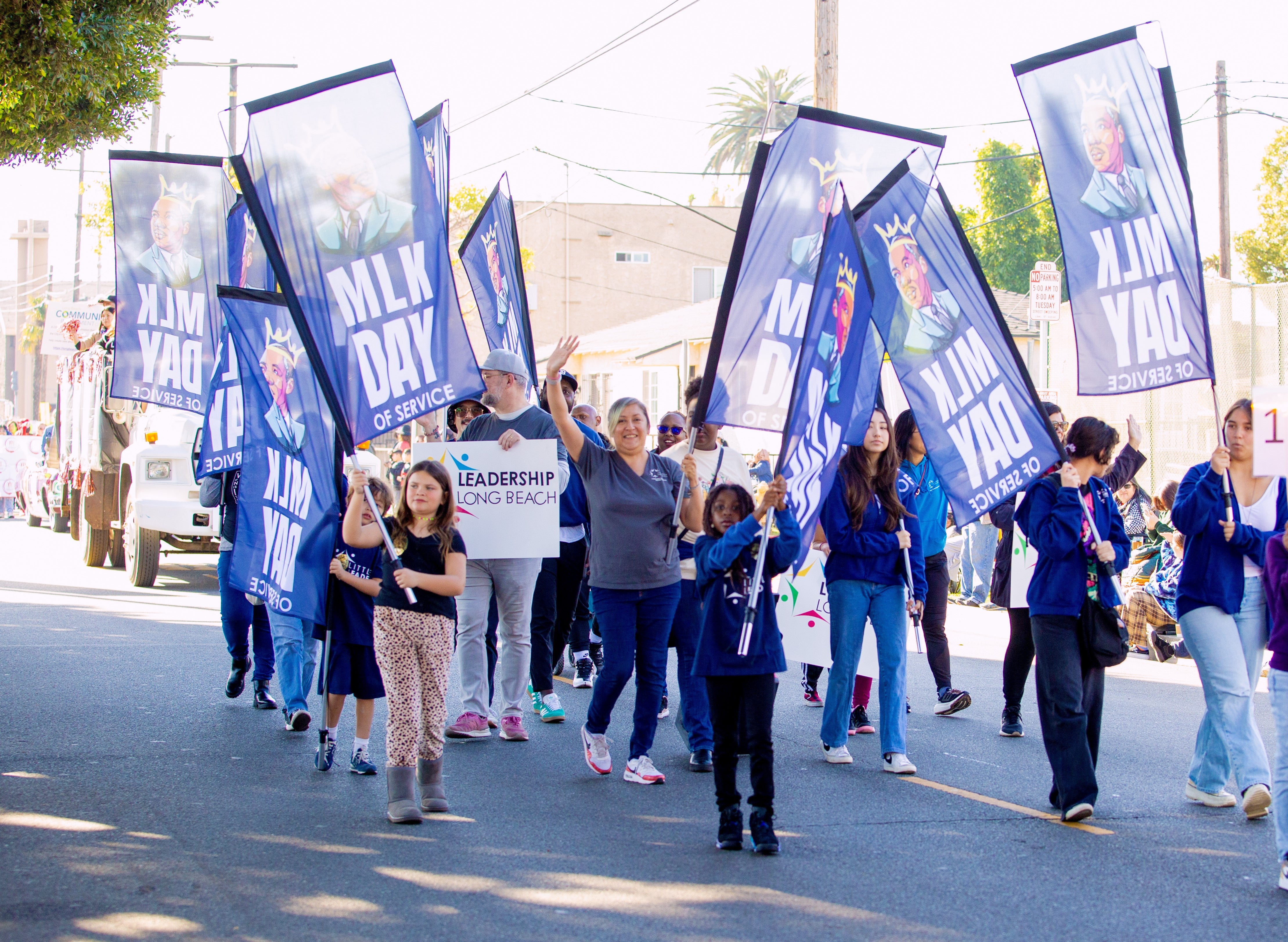 People waving flags in a parade People waving flags in a parade