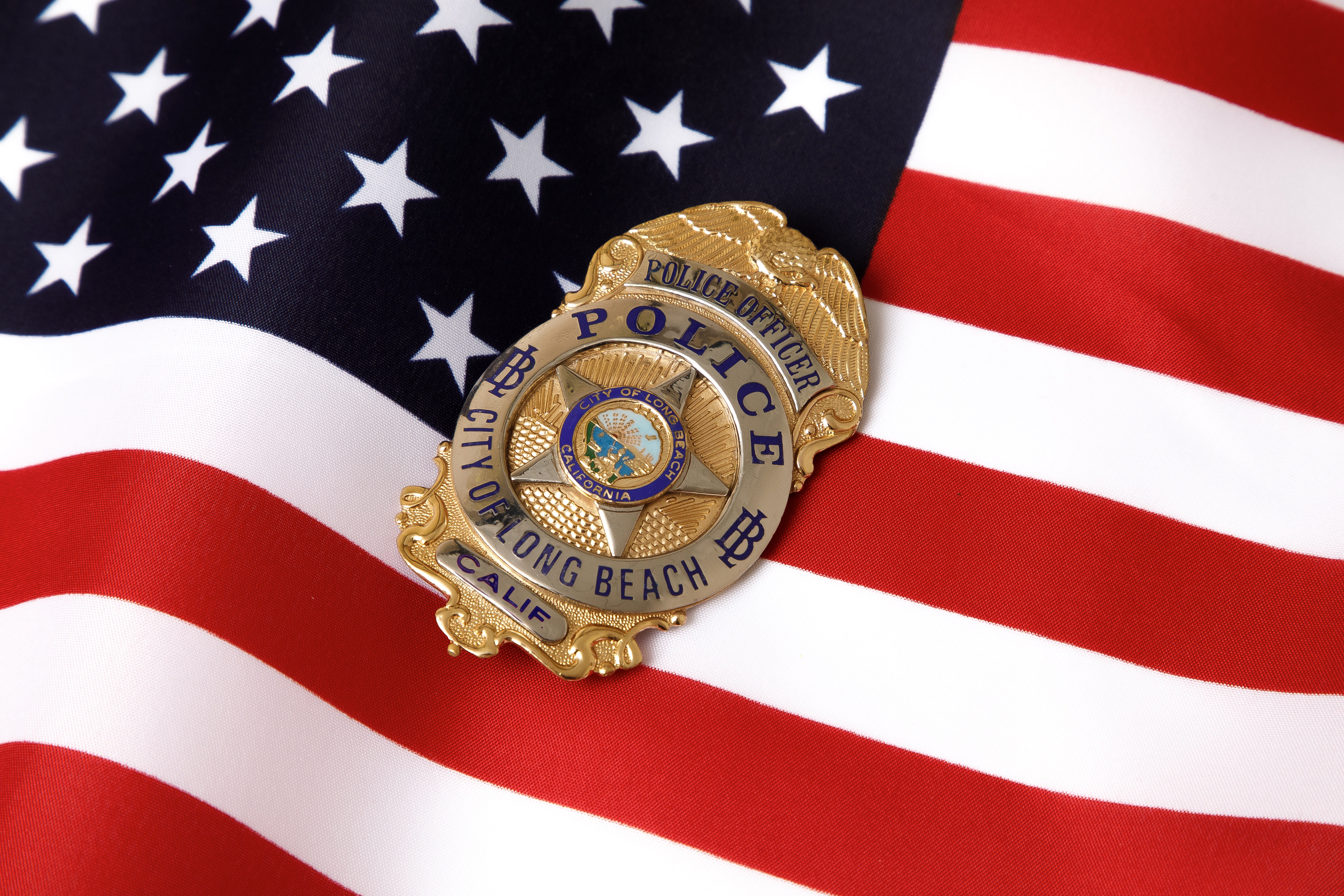 Police badge on an American flag 
