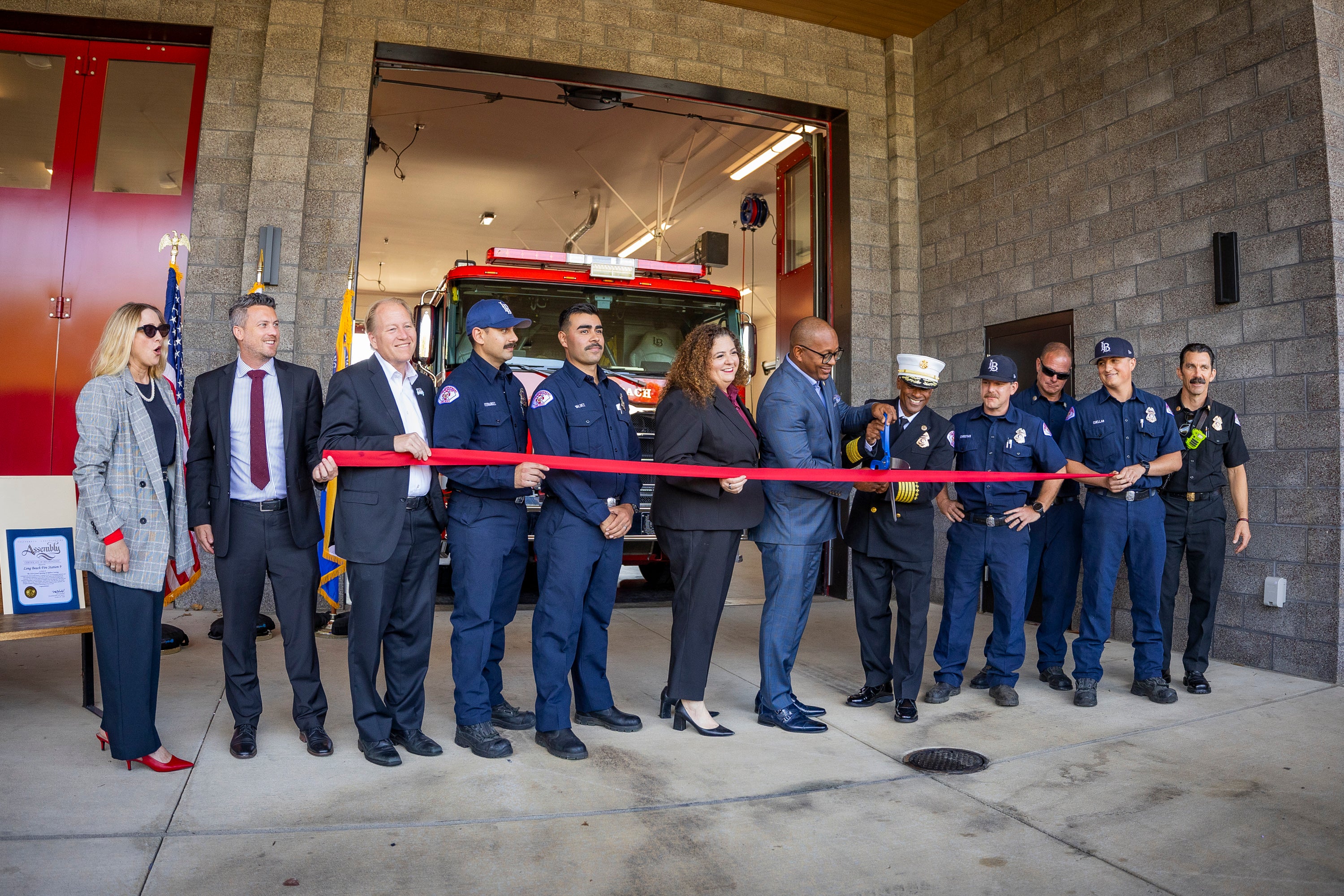 Mayor Rex Richardson and firefighters cutting the ribbon at the opening of Fire Station 9 ceremony.