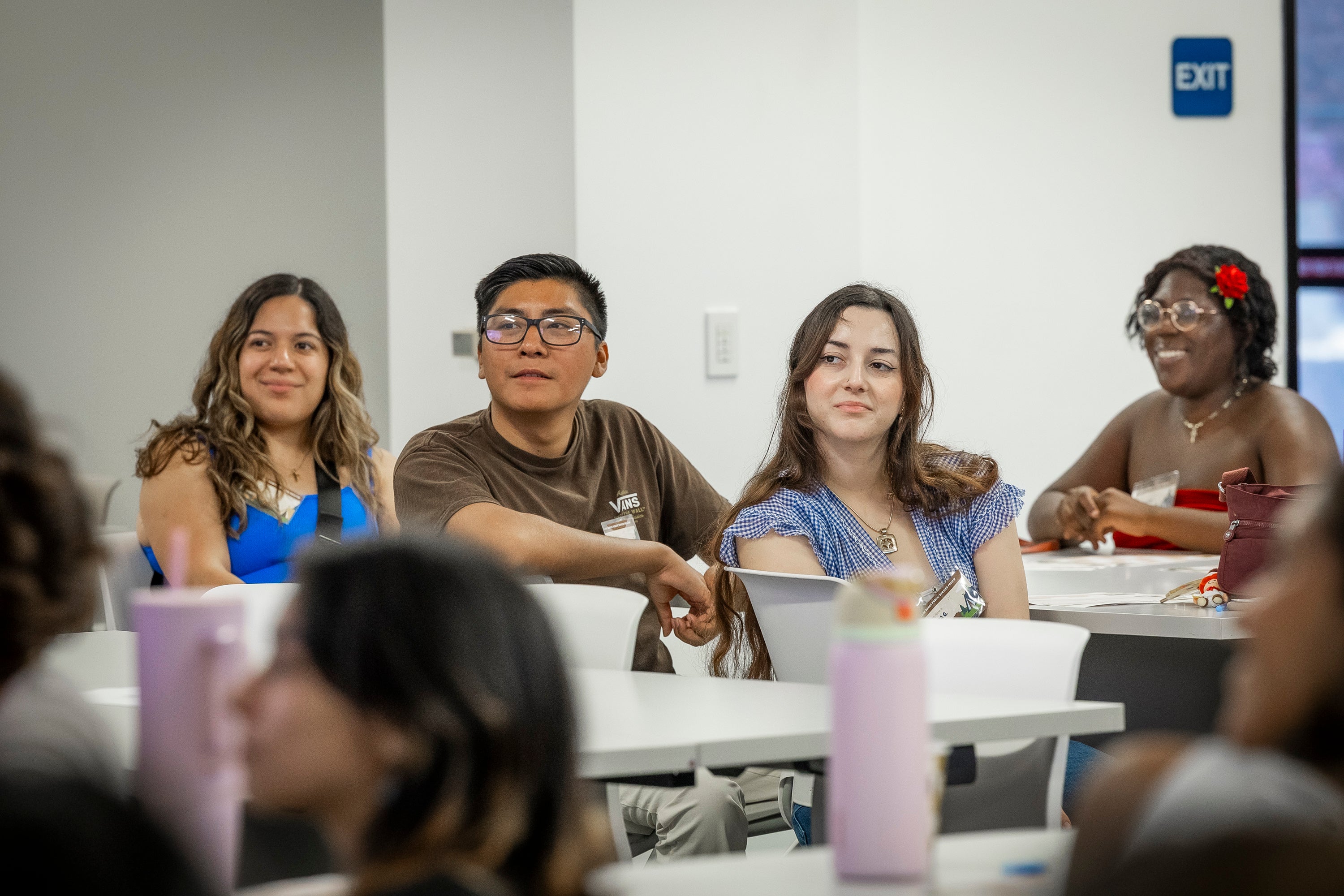 Four young adults sitting at a table 