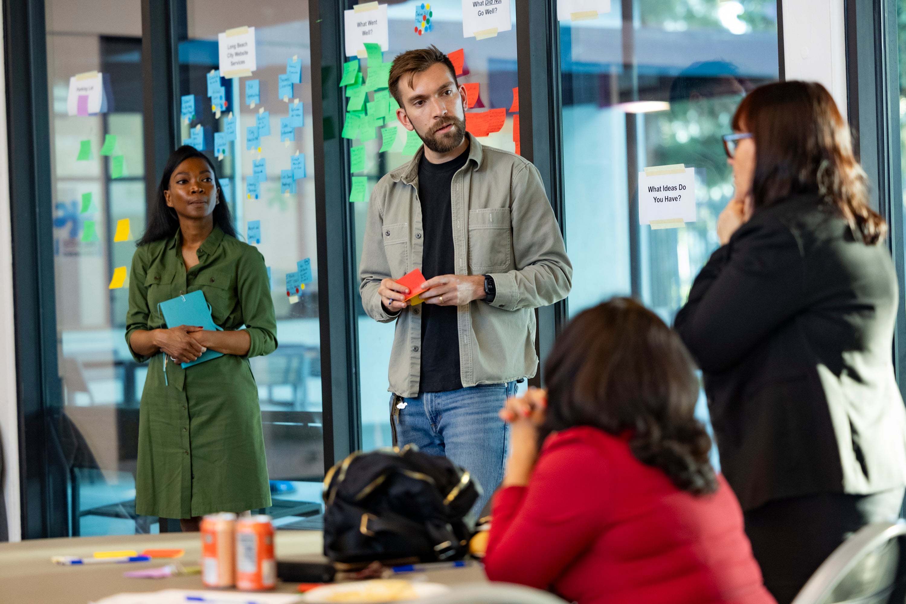 Three people standing in a room. Three people standing in a room.