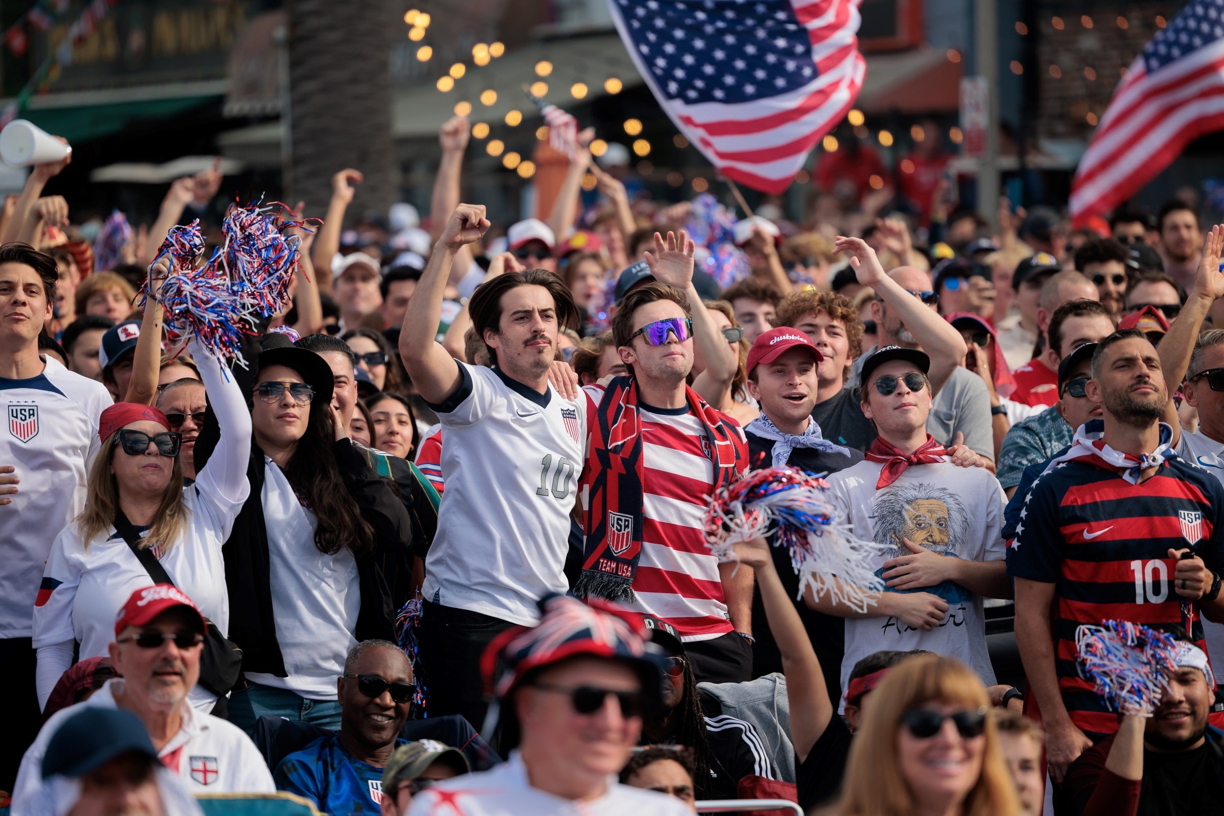 A crowd watching a soccer game. 