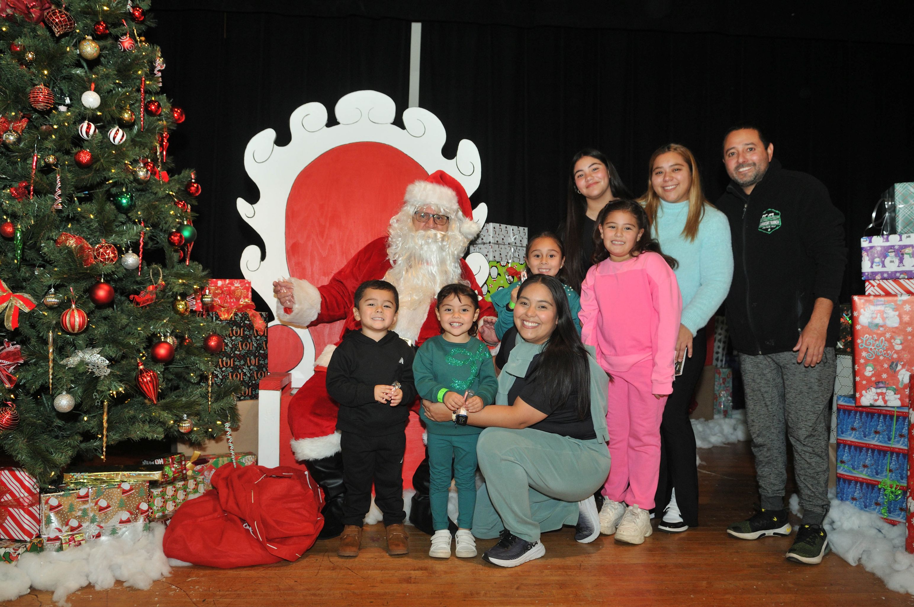 A family posing with Santa 