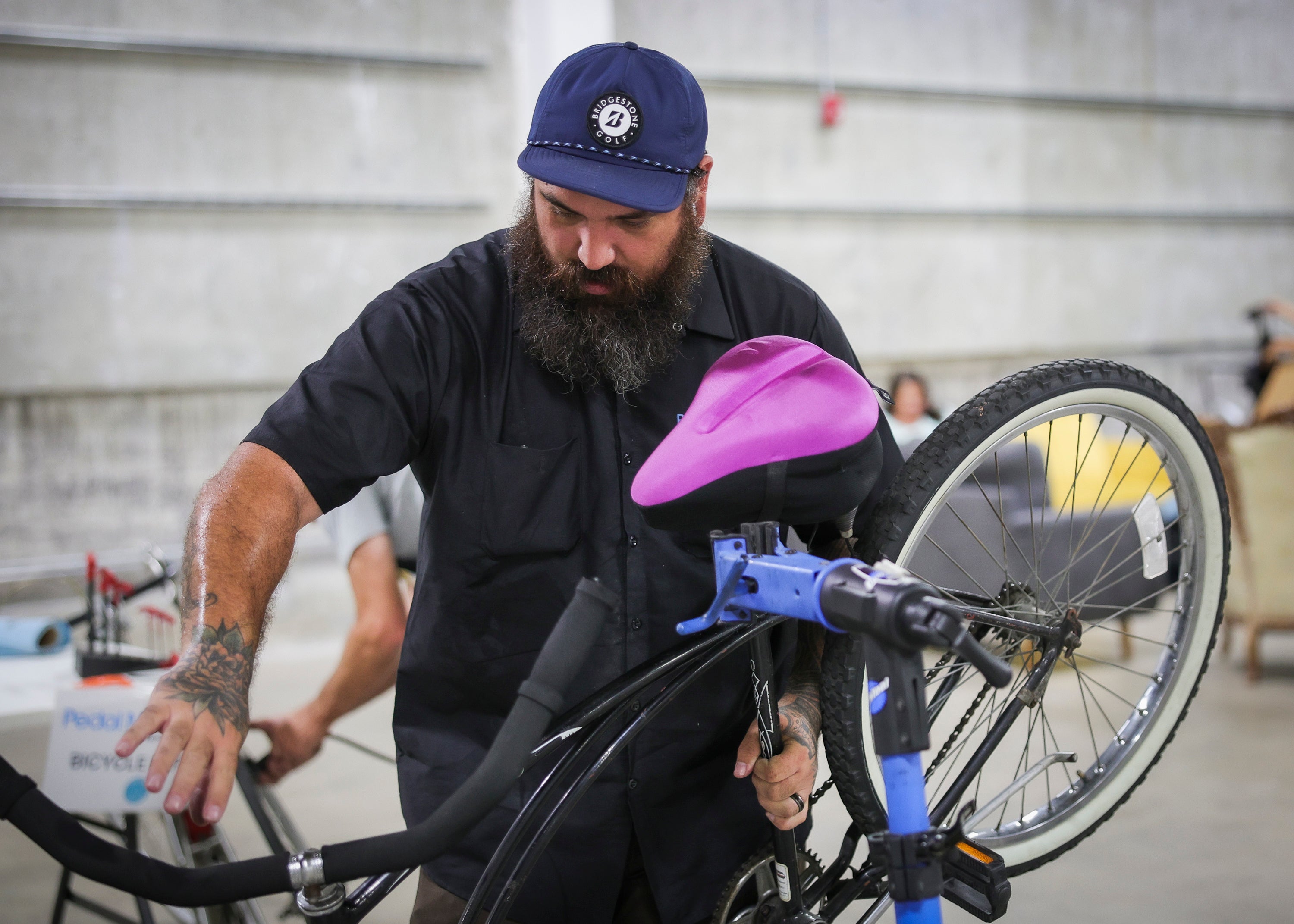 A man fixing a bicycle A man fixing a bicycle